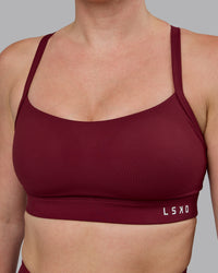 Woman wearing Momentum Sports Bra (D/DD/E) - Cordovan | Thumbnail Index: 3