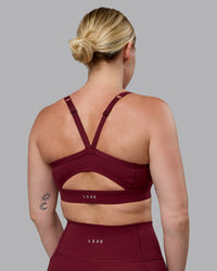 Woman wearing Momentum Sports Bra (D/DD/E) - Cordovan | Thumbnail Index: 1