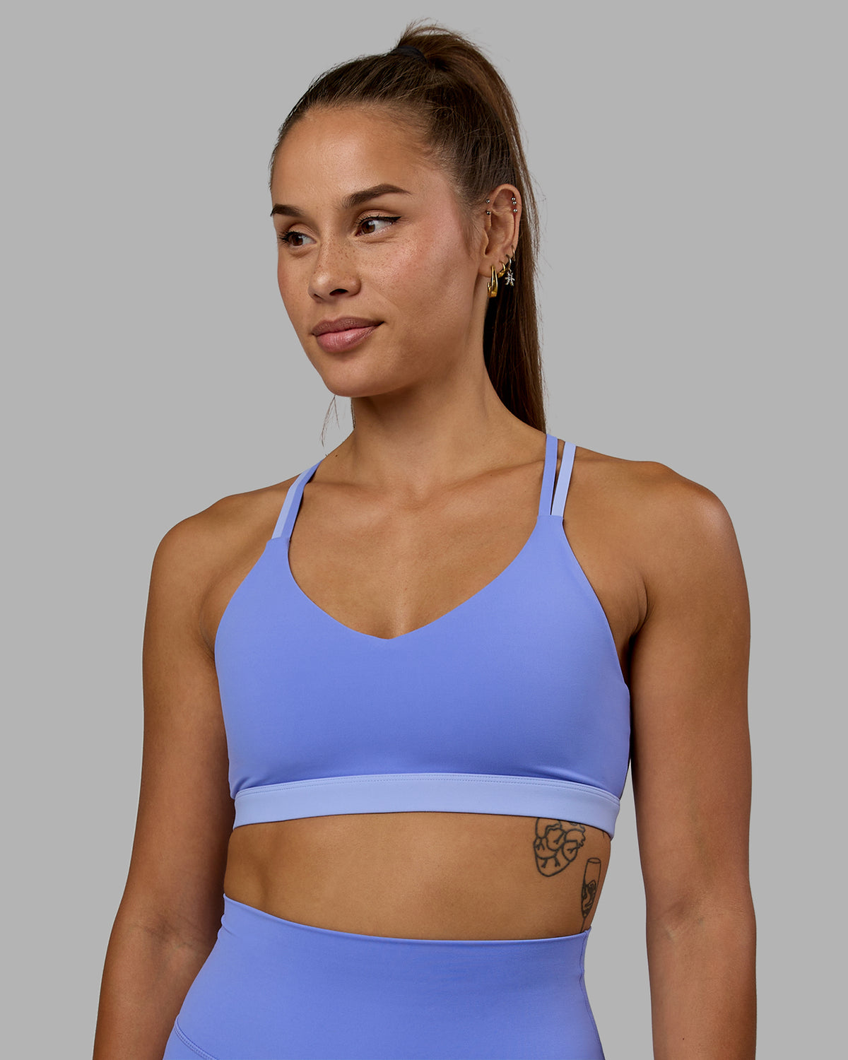 Woman wearing Nexus Sports Bra - Indulgent Blue