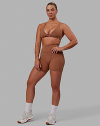 Woman wearing Nimble Sports Bra - Brick | Thumbnail Index: 7