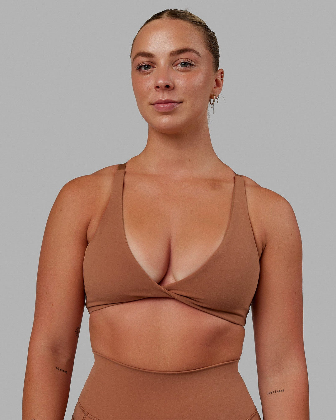 Woman wearing Nimble Sports Bra - Brick - view 1