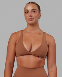 Woman wearing Nimble Sports Bra - Brick | Thumbnail Index: 0