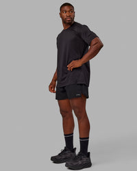 Man wearing Pace 5" Lined Performance Shorts - Black-Reflective | Thumbnail Index: 4