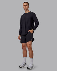Man wearing Pace 5" Lined Performance Shorts - Black-Retro Blue | Thumbnail Index: 4