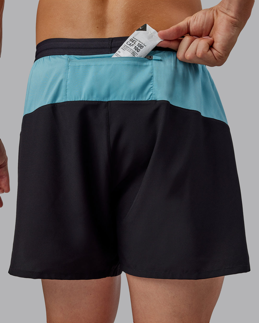 Man wearing Pace 5" Lined Performance Shorts - Black-Retro Blue - view 3