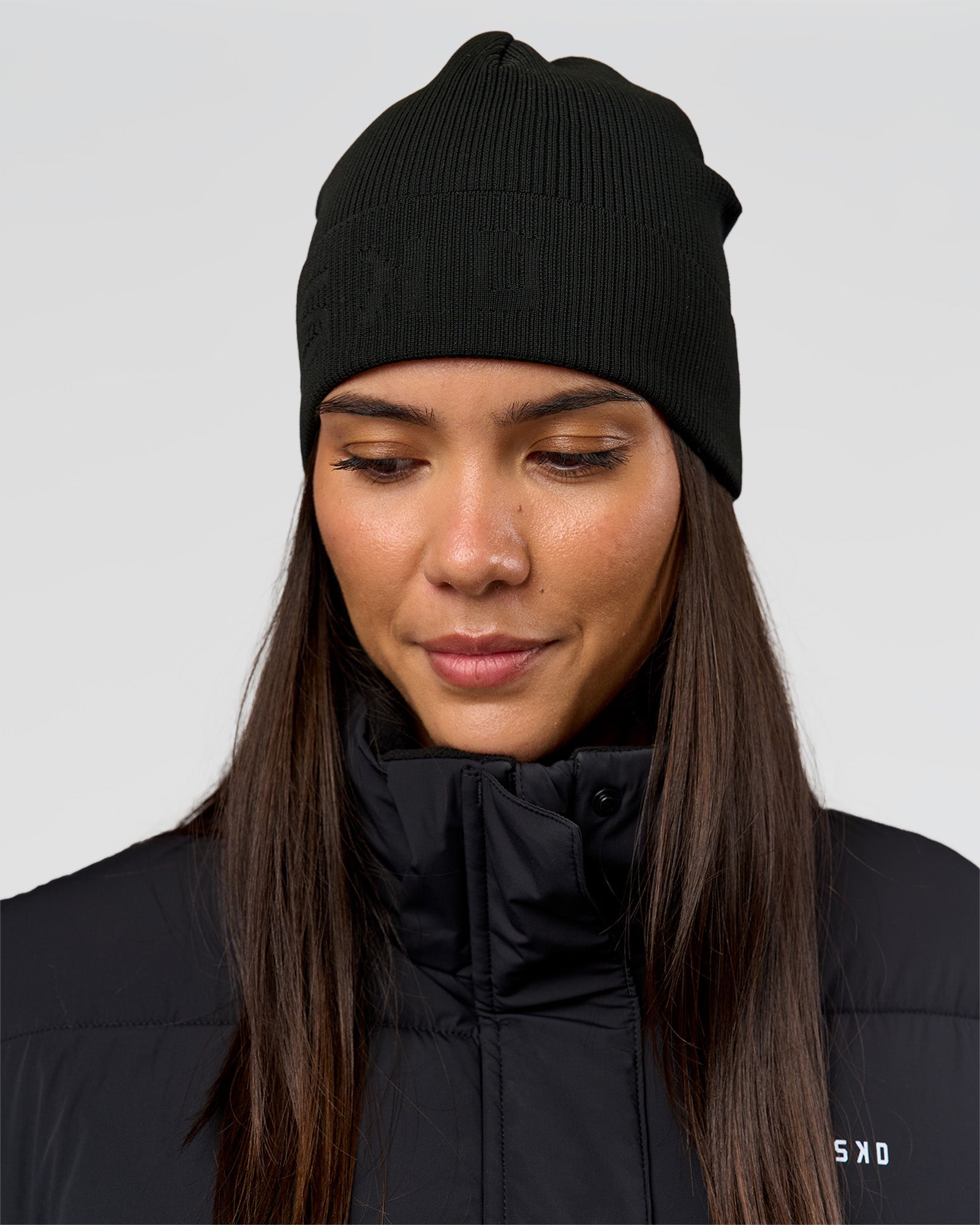Woman wearing Pace Beanie in Black 