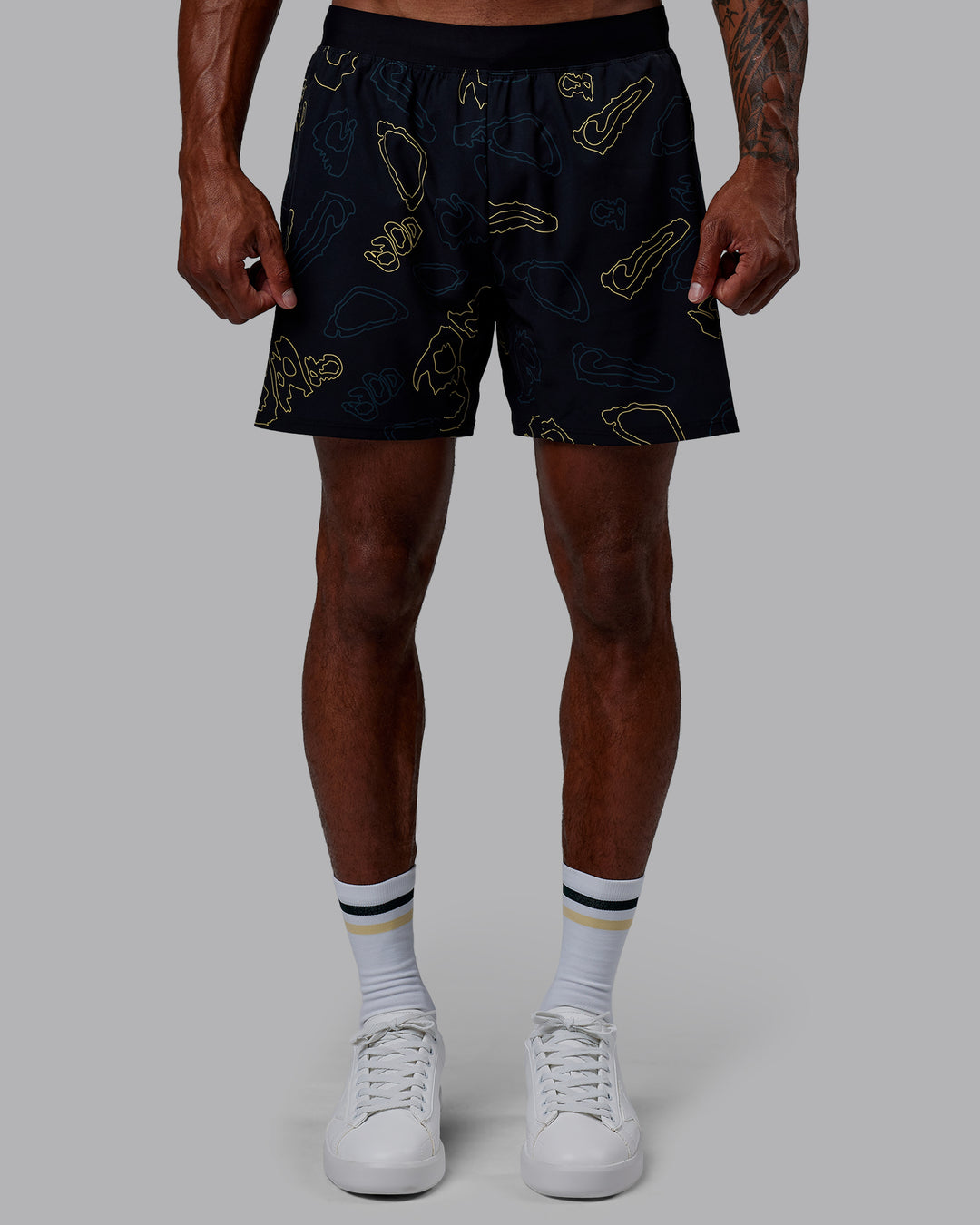 Man wearing Patty Mills Challenger 6" Performance Shorts - Black-Vital Green - view 6