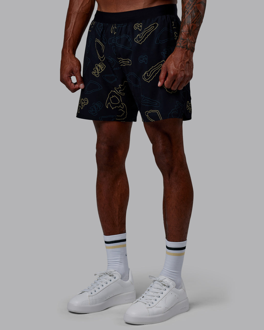 Man wearing Patty Mills Challenger 6" Performance Shorts - Black-Vital Green - view 10