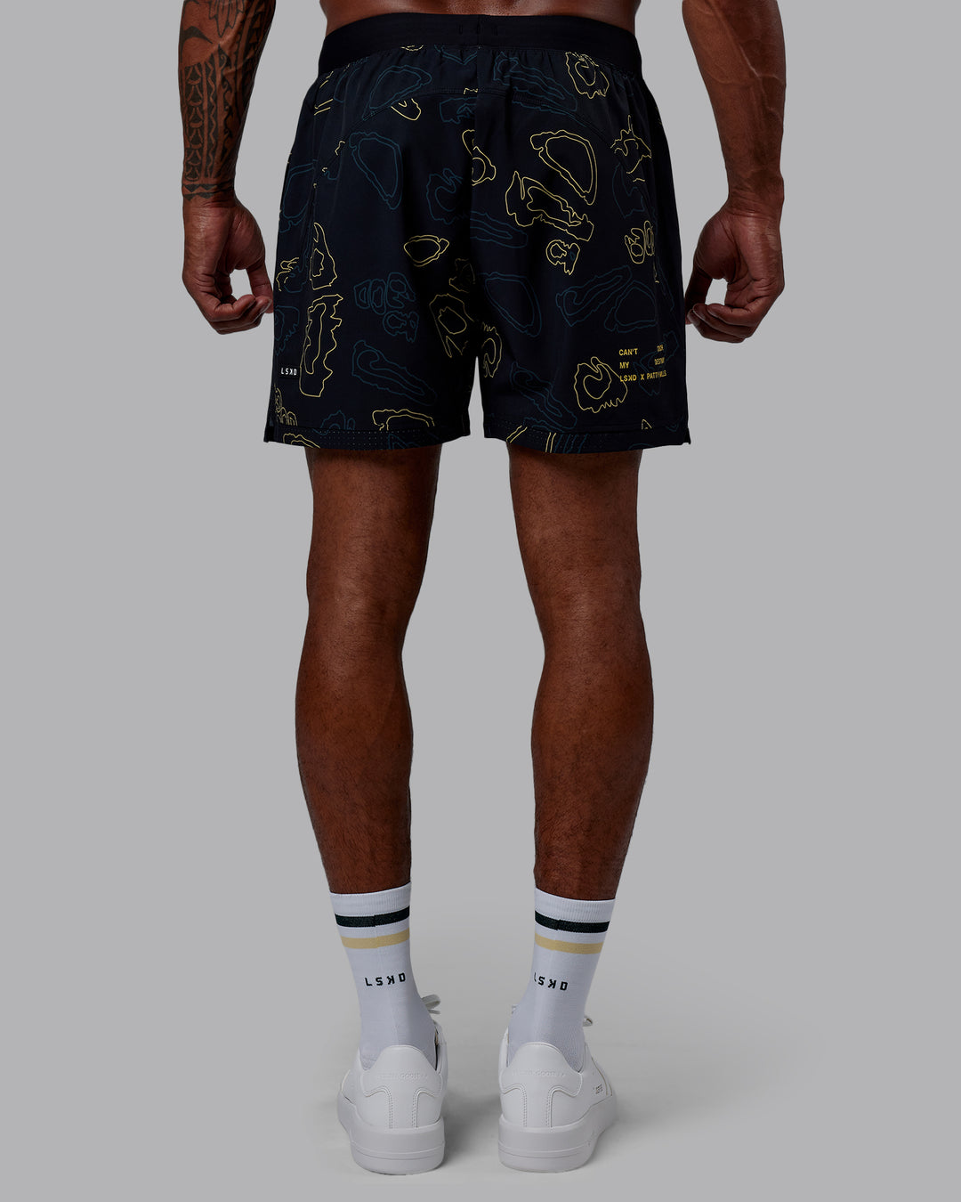 Man wearing Patty Mills Challenger 6" Performance Shorts - Black-Vital Green - view 5
