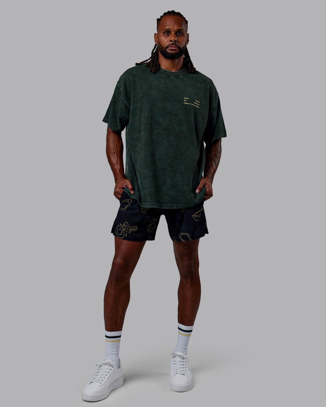 Man wearing Patty Mills Challenger 6" Performance Shorts - Black-Vital Green - view 9
