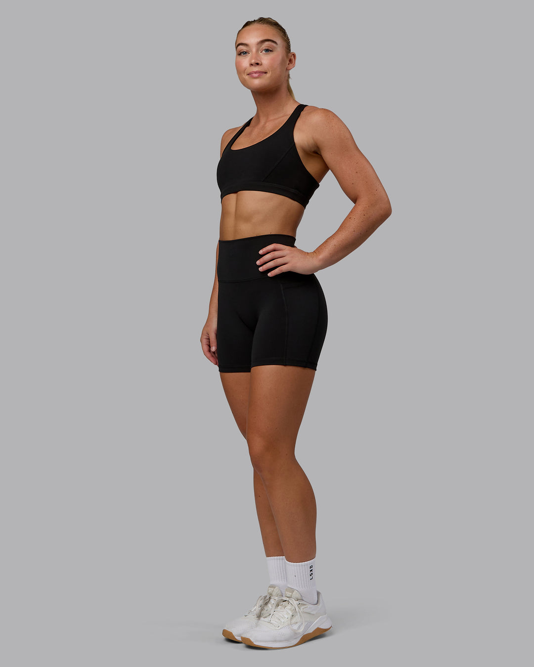 Woman wearing Precision Sports Bra - Black - view 3