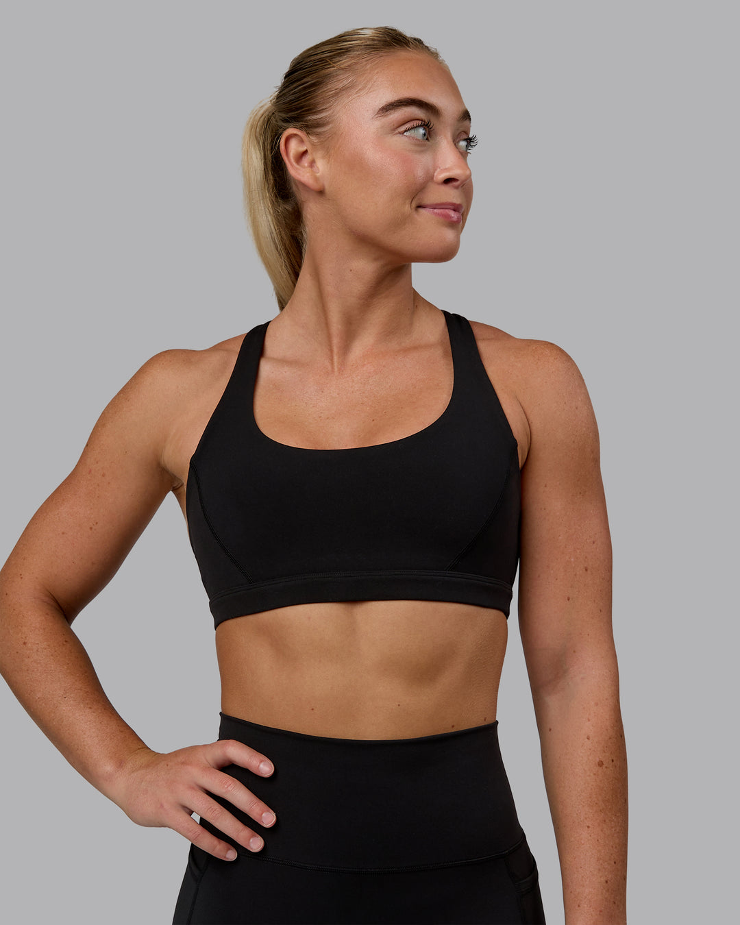 Woman wearing Precision Sports Bra - Black - view 4