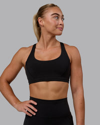 Woman wearing Precision Sports Bra - Black | Thumbnail Index: 3