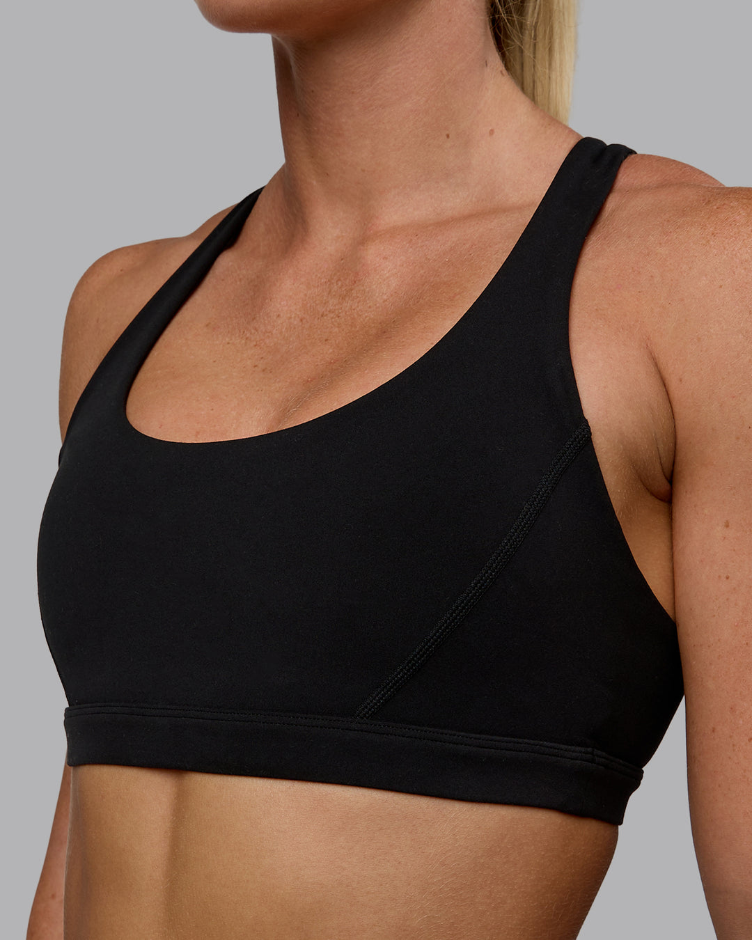 Woman wearing Precision Sports Bra - Black - view 1