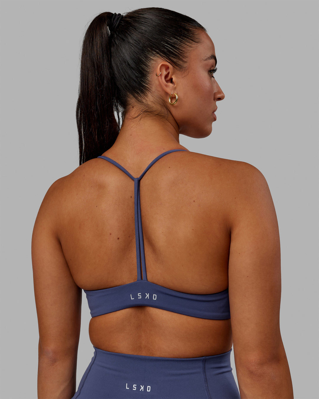Woman wearing Progression Sports Bra - Future Dusk - view 3