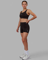 Woman wearing Propel Sports Bra - Dark Walnut | Thumbnail Index: 5