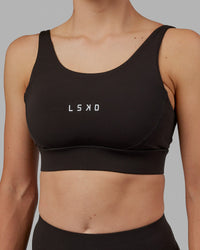 Woman wearing Propel Sports Bra - Dark Walnut | Thumbnail Index: 7