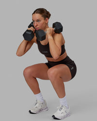 Woman wearing Propel Sports Bra - Dark Walnut | Thumbnail Index: 8