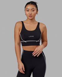 Woman wearing Pulse Sports Bra - Black | Thumbnail Index: 0