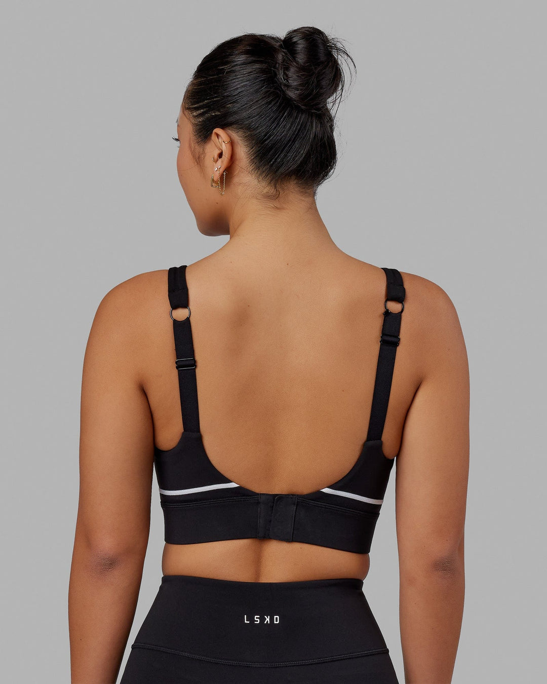Woman wearing Pulse Sports Bra - Black - view 5