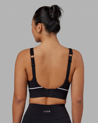 Woman wearing Pulse Sports Bra - Black | Thumbnail Index: 4