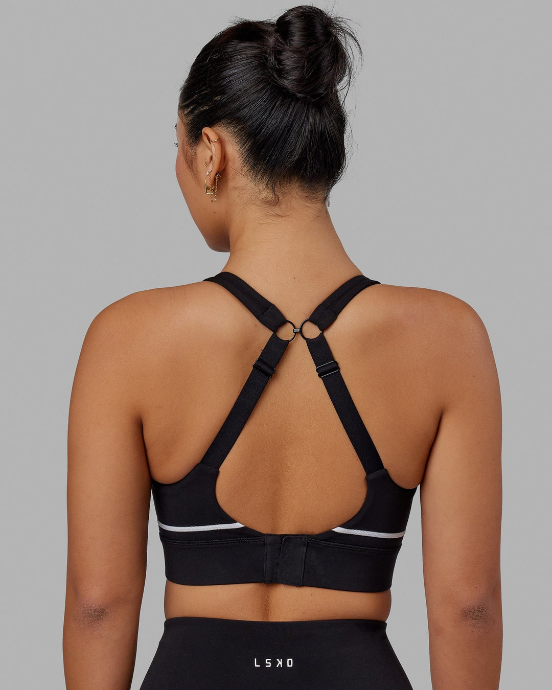 Woman wearing Pulse Sports Bra - Black - view 2
