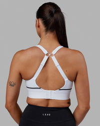 Woman wearing Pulse Sports Bra - White | Thumbnail Index: 1