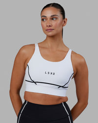 Woman wearing Pulse Sports Bra - White | Thumbnail Index: 2