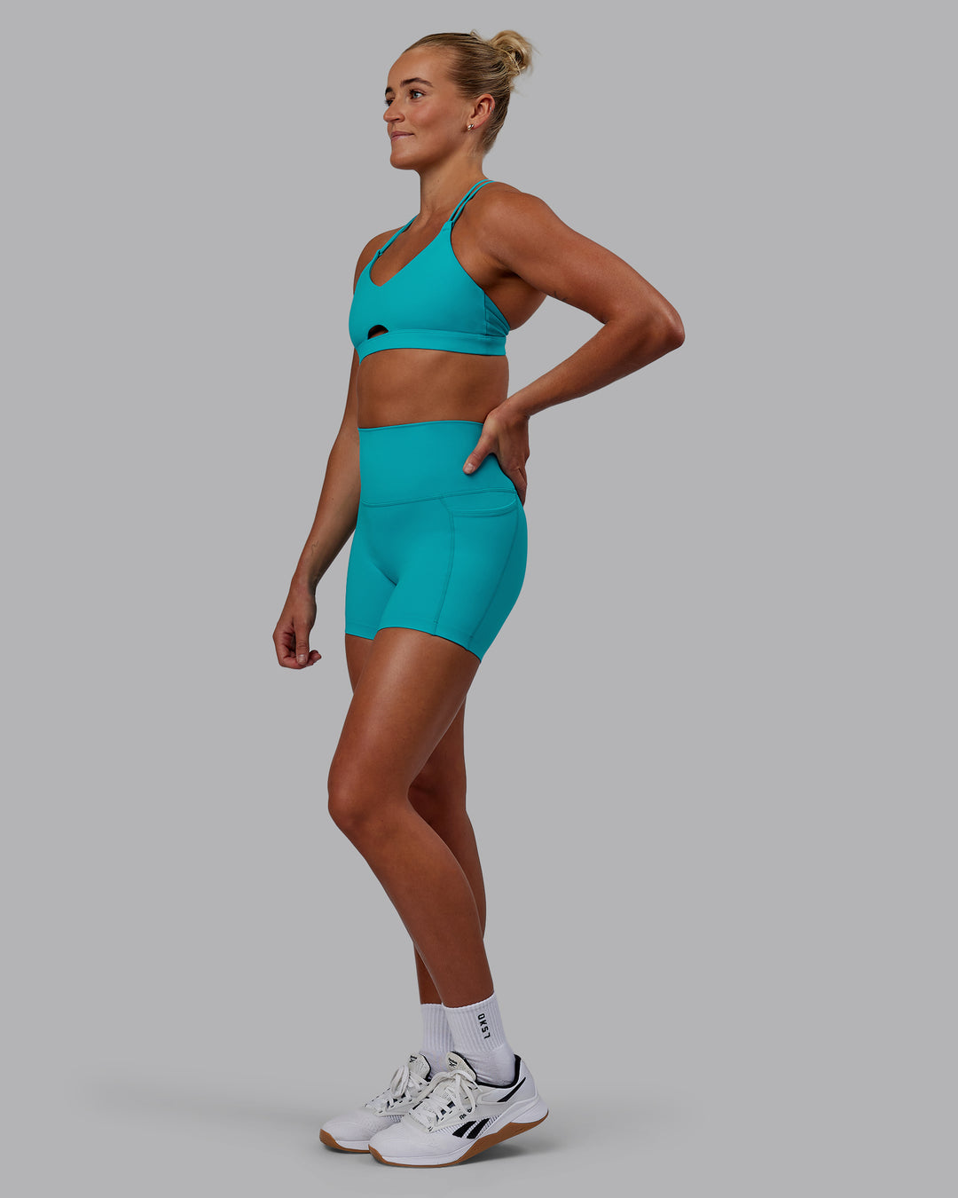Woman wearing Pursue Sports Bra - Blue Bird - view 4