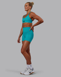 Woman wearing Pursue Sports Bra - Blue Bird | Thumbnail Index: 3