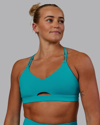 Woman wearing Pursue Sports Bra - Blue Bird | Thumbnail Index: 2