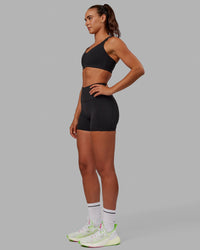 Woman wearing Push The Limit Sports Bra - Black | Thumbnail Index: 2