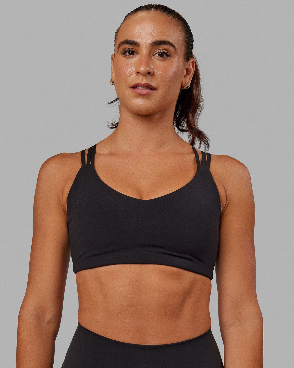 Woman wearing Push The Limit Sports Bra - Black