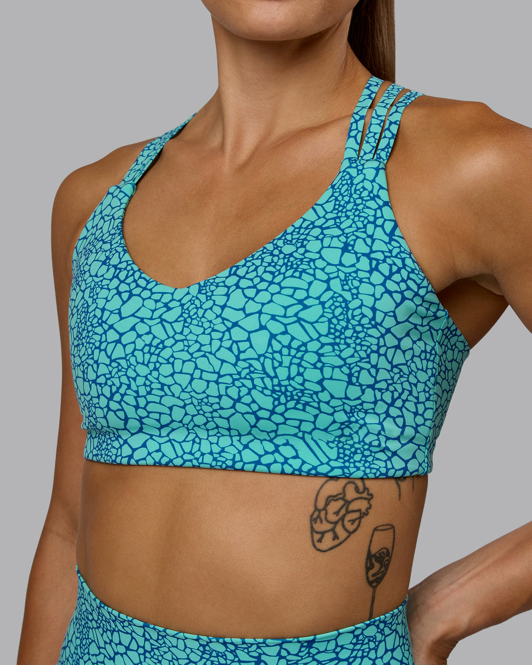 Woman wearing Push The Limit Sports Bra - Aquatic Awe Vitality Print - view 7