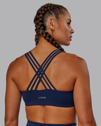 Woman wearing Push The Limit Sports Bra - Future Navy | Thumbnail Index: 4