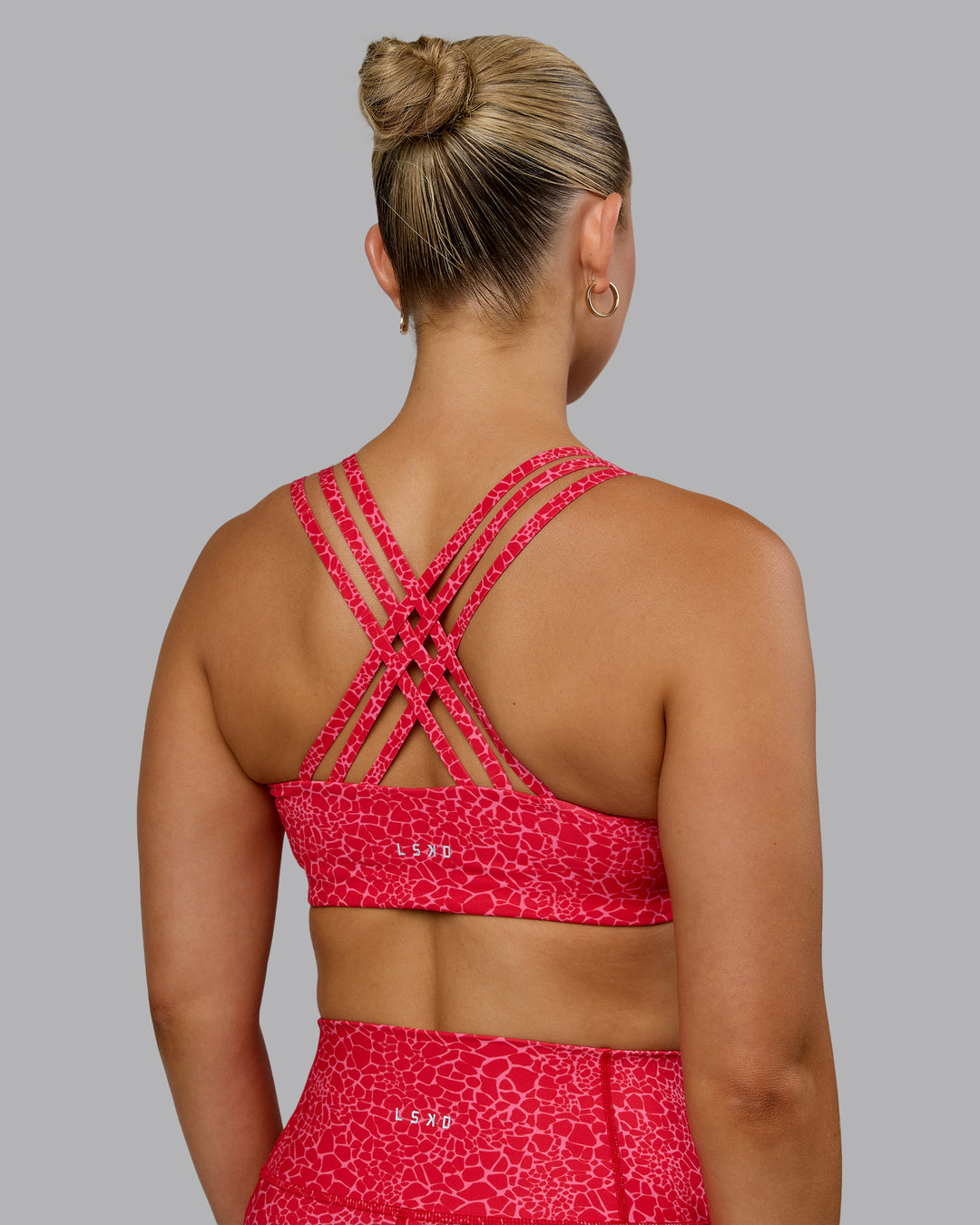 Woman wearing Push The Limit Sports Bra - Red Vitality Print - view 2