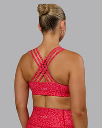 Woman wearing Push The Limit Sports Bra - Red Vitality Print | Thumbnail Index: 1