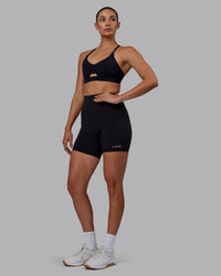Woman wearing RXD High-Rise 6" Short - Black | Thumbnail Index: 4