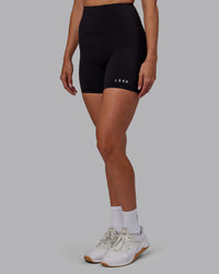 Woman wearing RXD High-Rise 6" Short - Black | Thumbnail Index: 0
