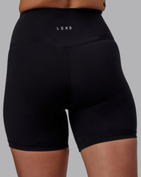 Woman wearing RXD High-Rise 6" Short - Black | Thumbnail Index: 6