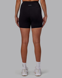 Woman wearing RXD High-Rise 6" Short - Black | Thumbnail Index: 3