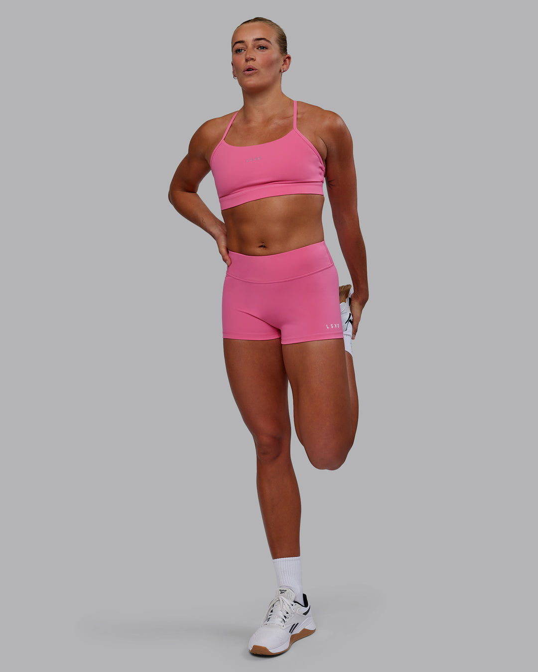 Woman wearing RXD Low-Rise 2" Short - Carmine Rose - view 5