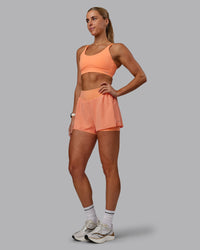 Woman wearing Rapid Sports Bra - Cantaloupe | Thumbnail Index: 5