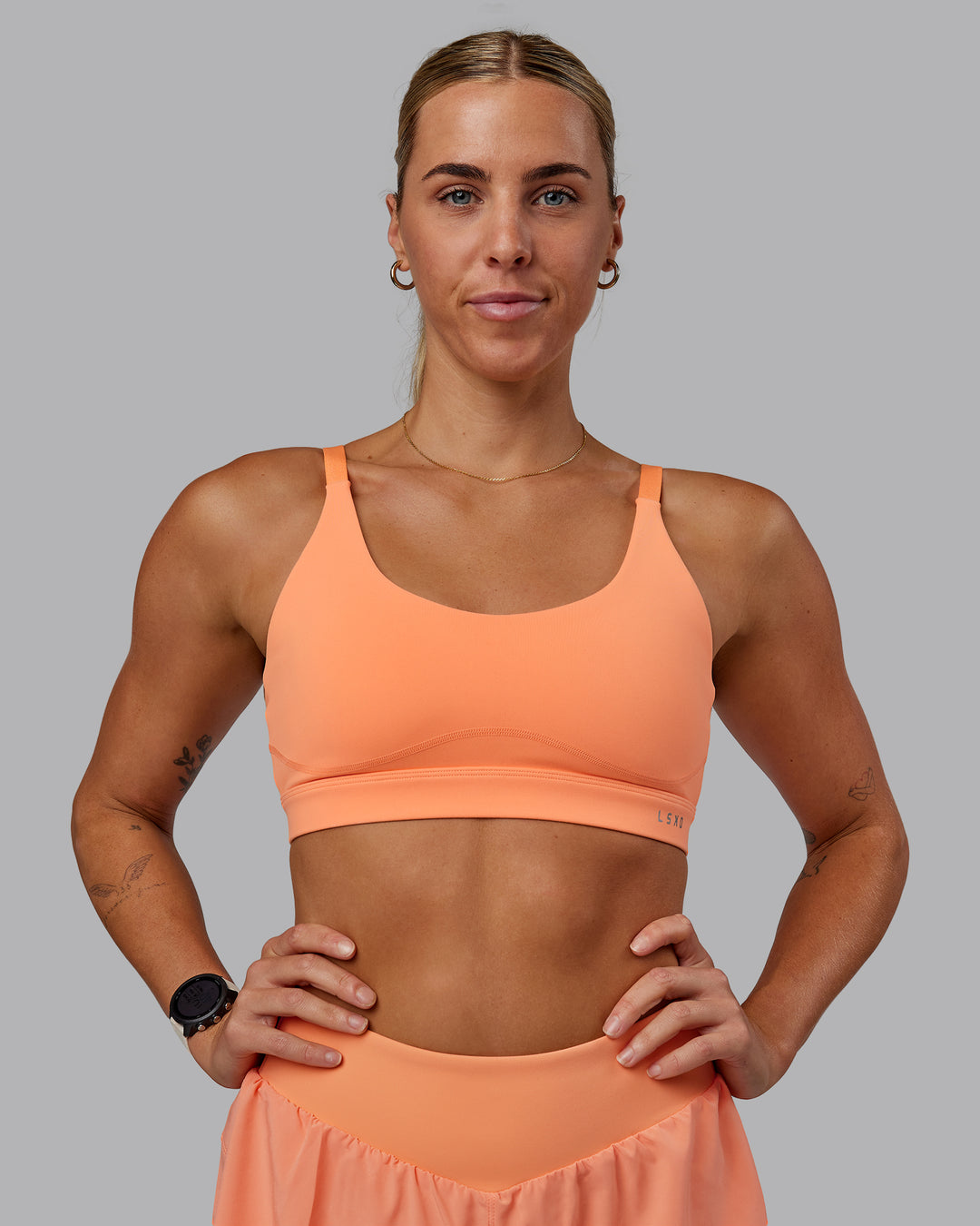Woman wearing Rapid Sports Bra - Cantaloupe - view 5