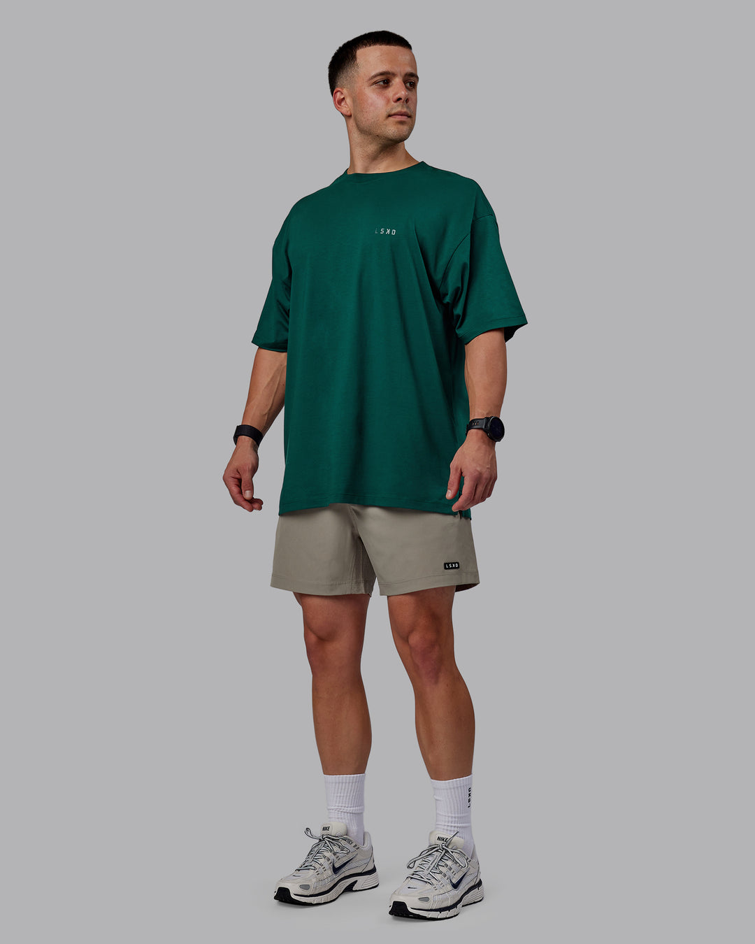 Man wearing Rep 5" Performance Shorts - Elephant - view 2