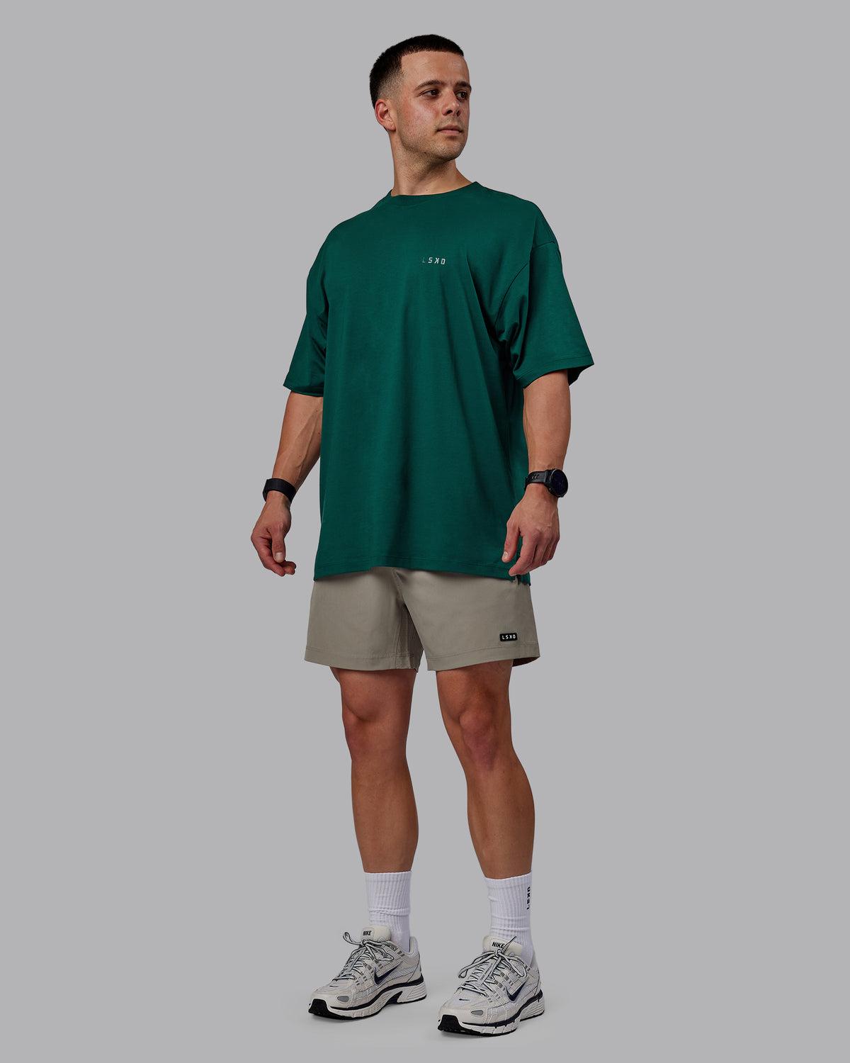 Man wearing Rep 5" Performance Shorts - Elephant