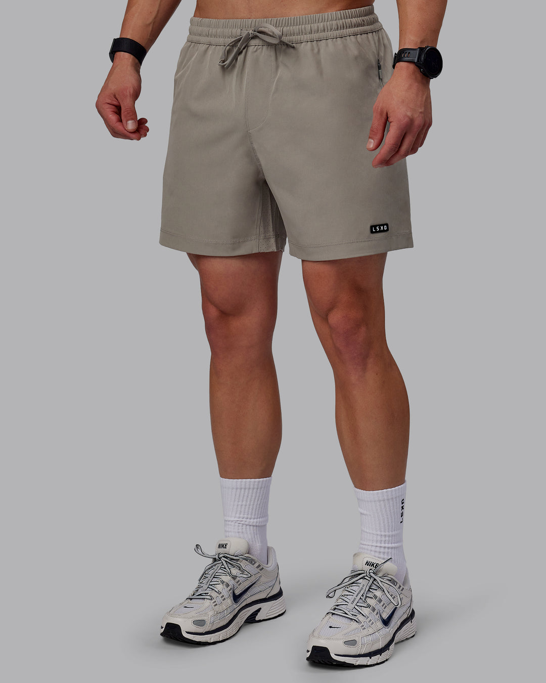 Man wearing Rep 5" Performance Shorts - Elephant - view 4