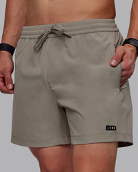 Man wearing Rep 5" Performance Shorts - Elephant | Thumbnail Index: 0