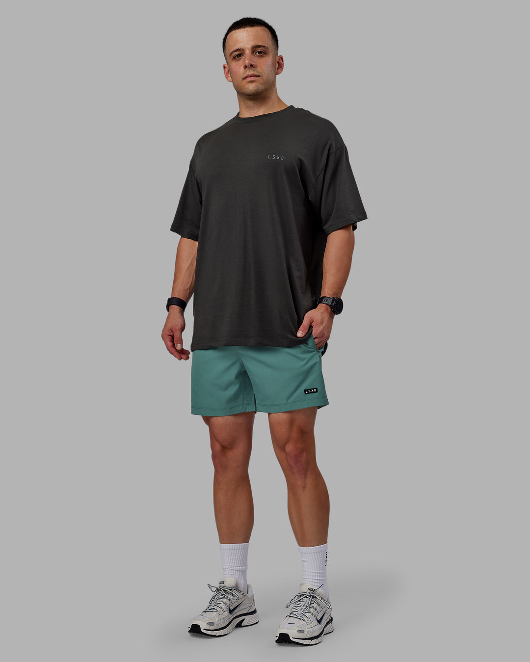 Man wearing Rep 5" Performance Shorts - Sage Bush - view 4