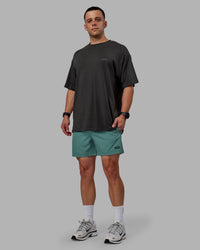 Man wearing Rep 5" Performance Shorts - Sage Bush | Thumbnail Index: 3